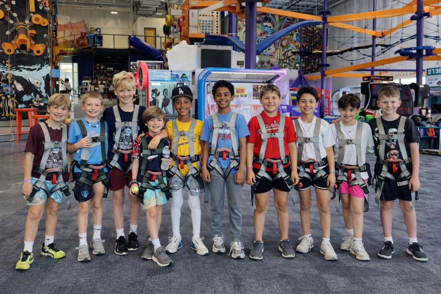 A big group of kids geared up and ready to climb at UP!